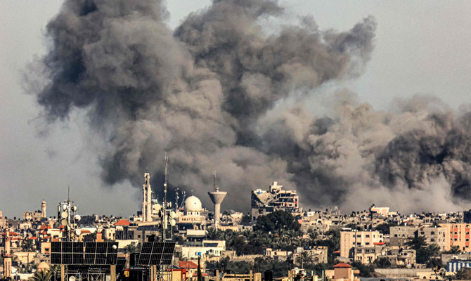 Smoke billows from Israeli bombardment over Khan Yunis from Rafah in the southern Gaza Strip on December 16, 2023, amid ongoing battles between Israel and the Palestinian militant group Hamas. (AFP)