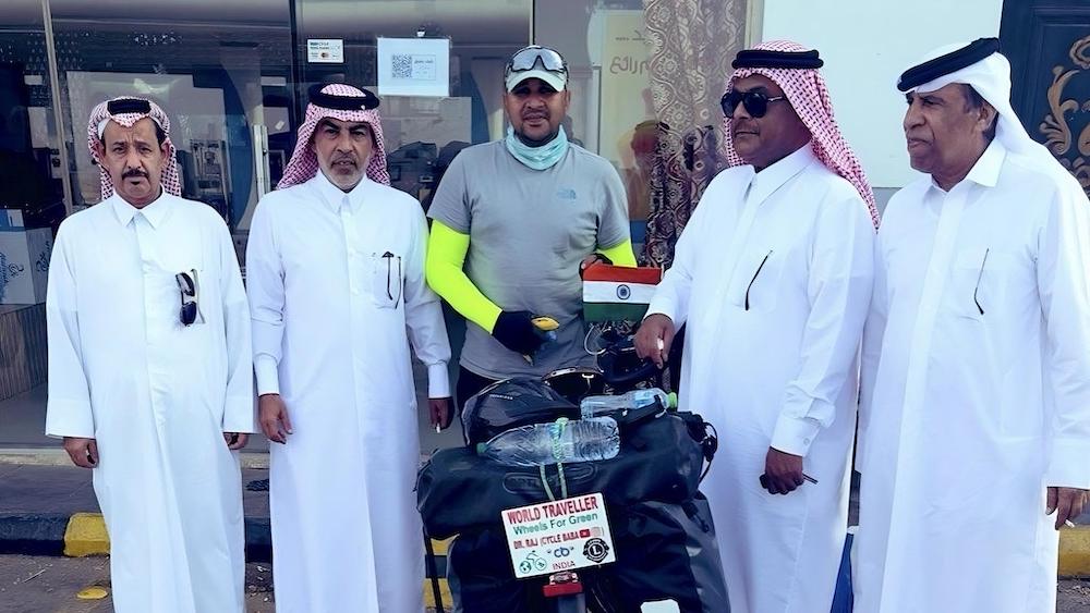 Raj Phanden poses with Saudis who welcomed him in the Kingdom after he crossed the Qatar border on Dec. 9, 2023. (Raj Phanden)