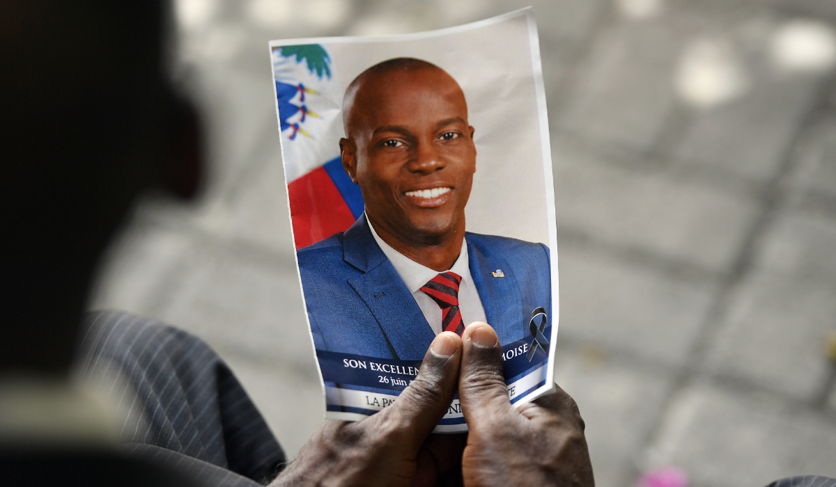 A person holds a photo of late Haitian President Jovenel Moise during his memorial ceremony at the National Pantheon Museum in Port-au-Prince, Haiti, July 20, 2021. (AP)