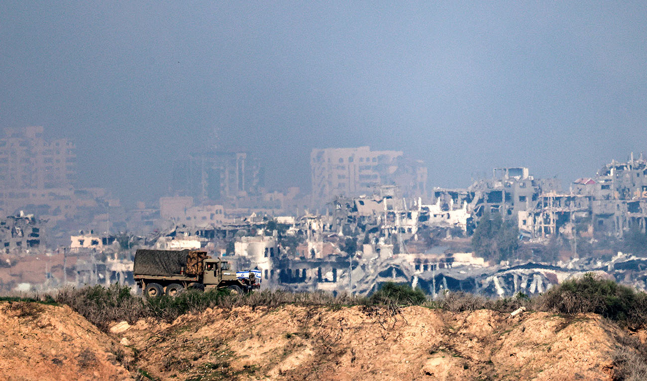 An Israeli army truck moves along the border with the northern Gaza Strip from a position in southern Israel on December 19, 2023. (AFP/File)