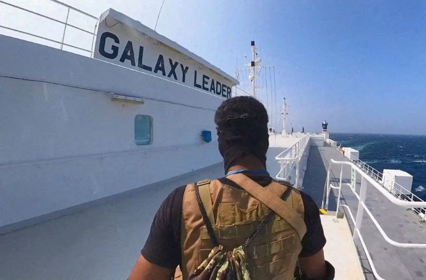 A Houthi fighter stands on the Galaxy Leader cargo ship in the Red Sea, Nov. 20, 2023. (Reuters)