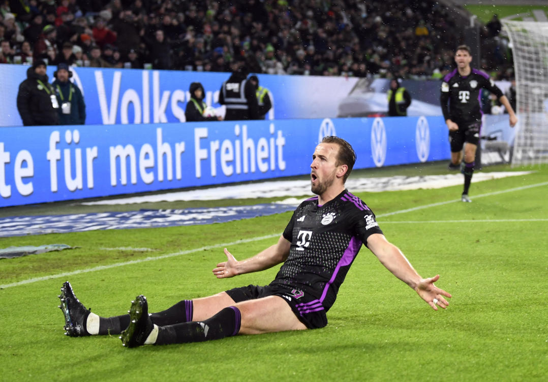 Bayern Munich's Harry Kane celebrates scoring their second goal during their Bundesliga match against VfL Wolfsburg at Volkswagen Arena, Wolfsburg on Dec. 20, 2023. (Reuters)