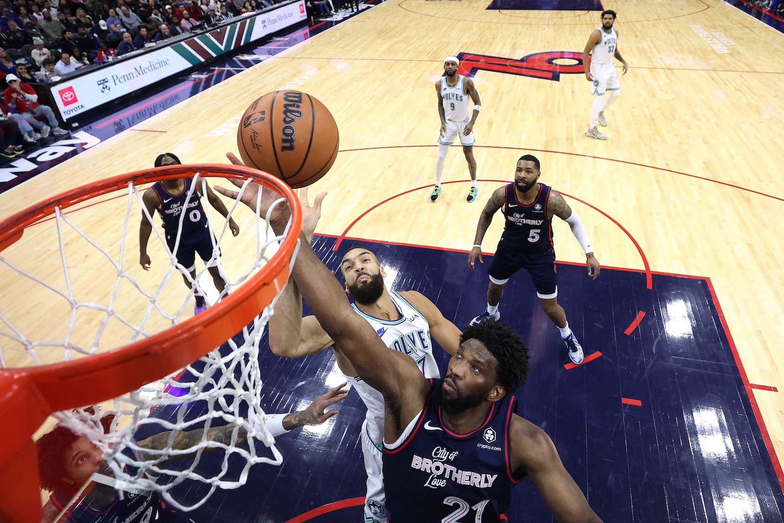 Joel Embiid of the Philadelphia 76ers reaches for a rebound past Rudy Gobert of the Minnesota Timberwolves during the fourth quarter of an NBA game at the Wells Fargo Center on Dec. 20, 2023 in Philadelphia, Pennsylvania. (GETTY IMAGES NORTH AMERICA / AFP)