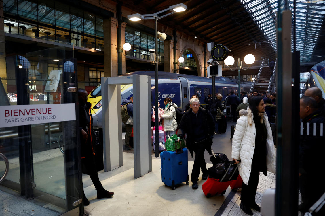 Passengers walk on a platform after their arrival from London at the Eurostar terminal at Gare du Nord train station, as an unexpected strike by French workers at Eurotunnel, the undersea link between Britain and continental Europe, interrupted cross-Channel rail traffic, threatening the Christmas holiday plans of many travelers, in Paris, on Dec. 21, 2023. (Reuters)