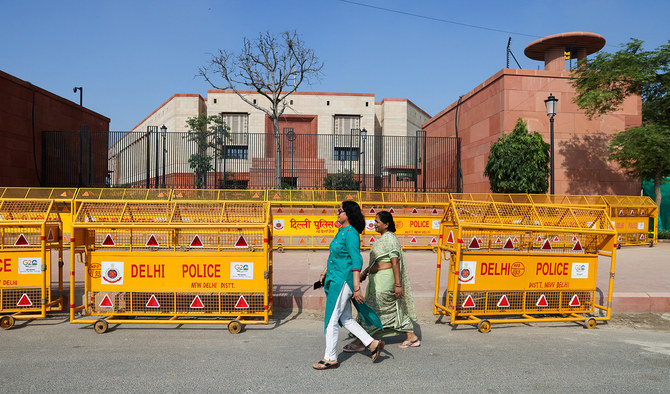 Women walk past India's new parliament in New Delhi, India, on September 20, 2023. (REUTERS)
