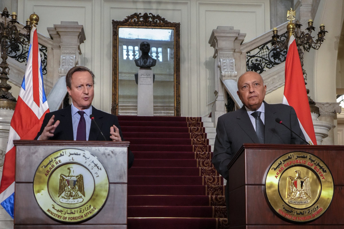British FM David Cameron, left, and Egyptian FM Sameh Shoukry speak during a press conference at Tahrir Palace in Cairo on Dec. 21, 2023. (Egyptian Foreign Ministry Media Office via AP)