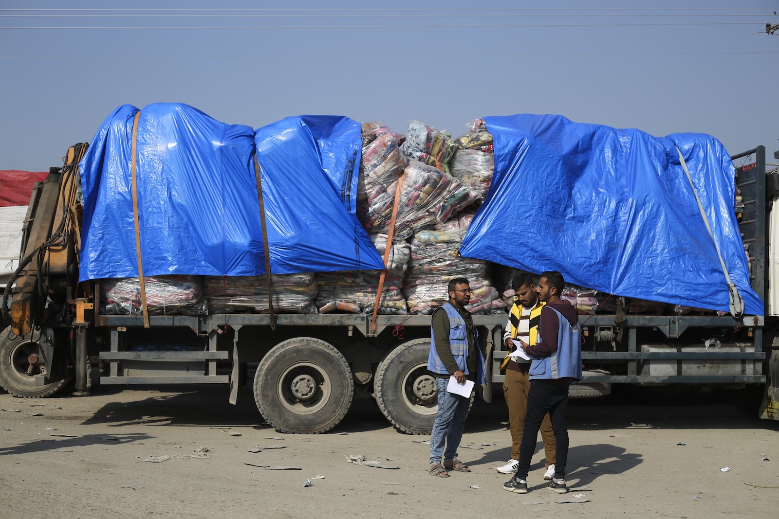 Humanitarian aid trucks enter through the Kerem Shalom crossing from Israel into the Gaza Strip on Monday, Dec. 18, 2023. (AP)