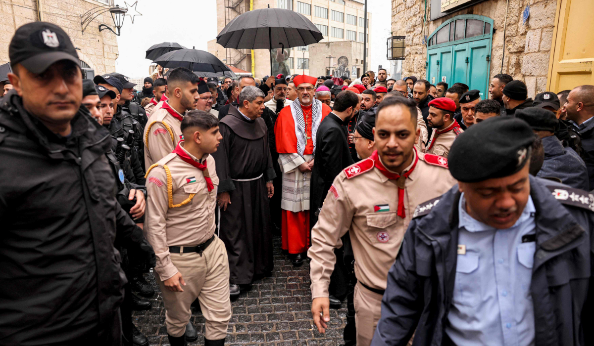 Latin Patriarch of Jerusalem Pierbattista Pizzaballa (C) arrives in the biblical city of Bethlehem in the occupied West Bank ahead of Christmas Eve celebrations (according to Western tradition) on December 24, 2023. (AFP)