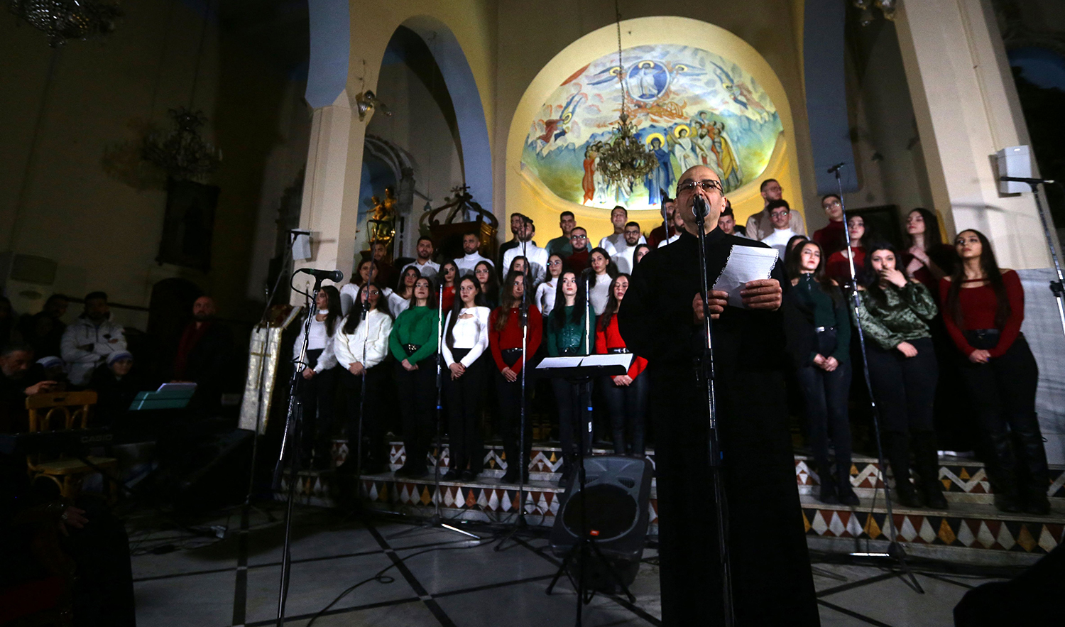 Syrians sing Christmas songs at a church in the capital Damascus on December 23, 2023. (AFP)