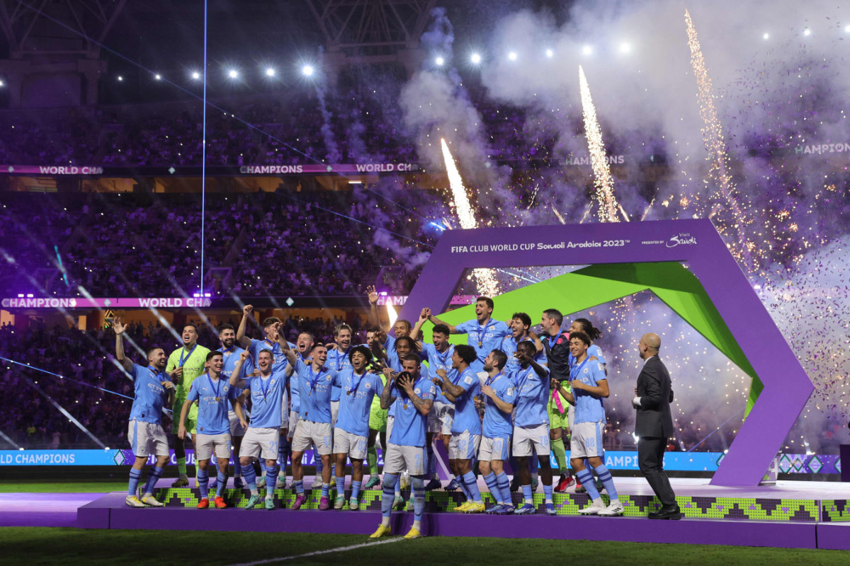 Manchester City's English defender #02 Kyle Walker lifts the trophy after the FIFA Club World Cup final football match between Brazil's Fluminense and England's Manchester City at the King Abdullah Sports City in Jeddah on December 22, 2023. (AFP)