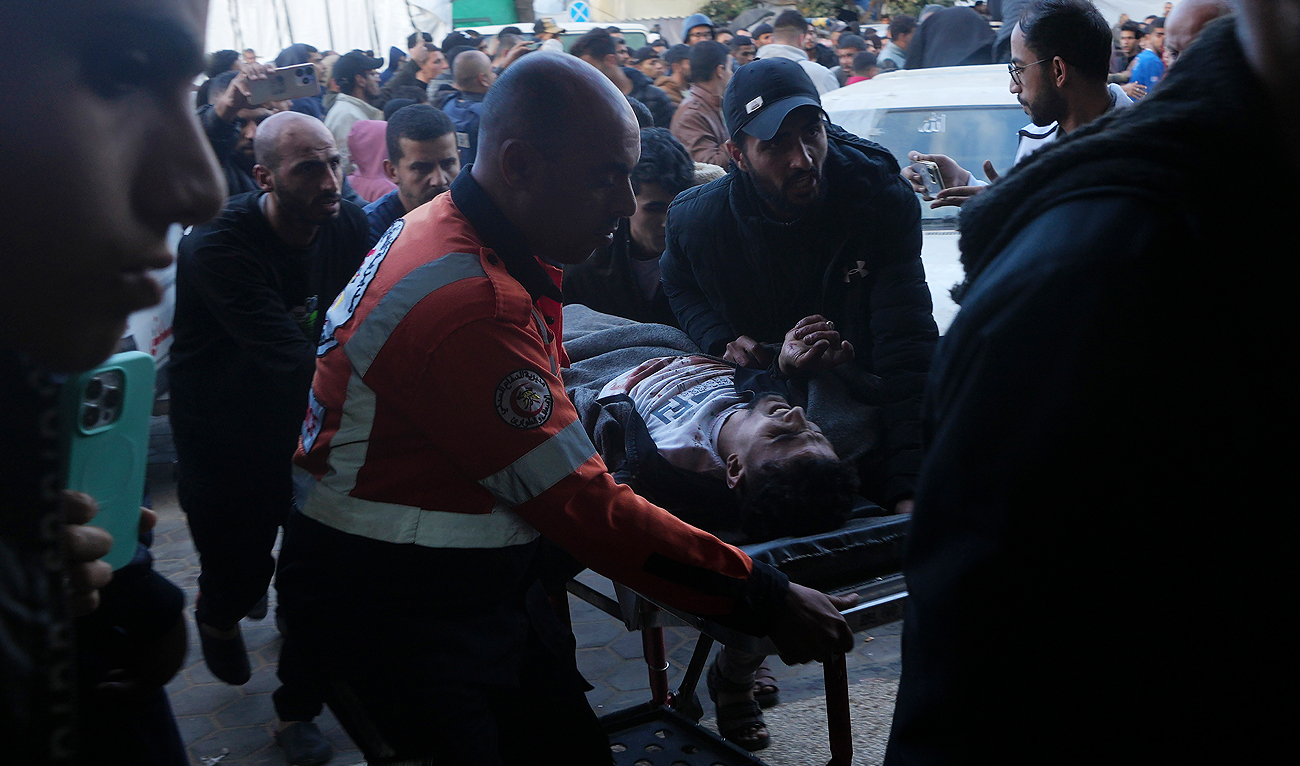 Palestinians wounded in the Israeli bombardment of the Gaza Strip are brought to the hospital in Deir al Balah, Gaza Strip, on Sunday, Dec. 24, 2023. (AP)