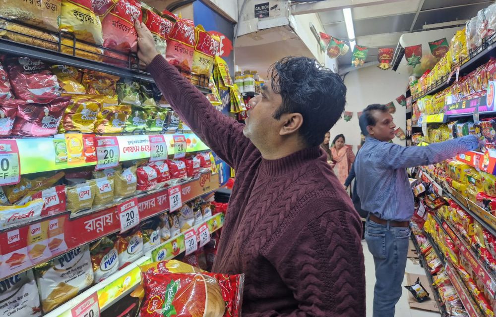 A customer browse through the spice section at a local supermarket in Dhaka. (AN Photo)