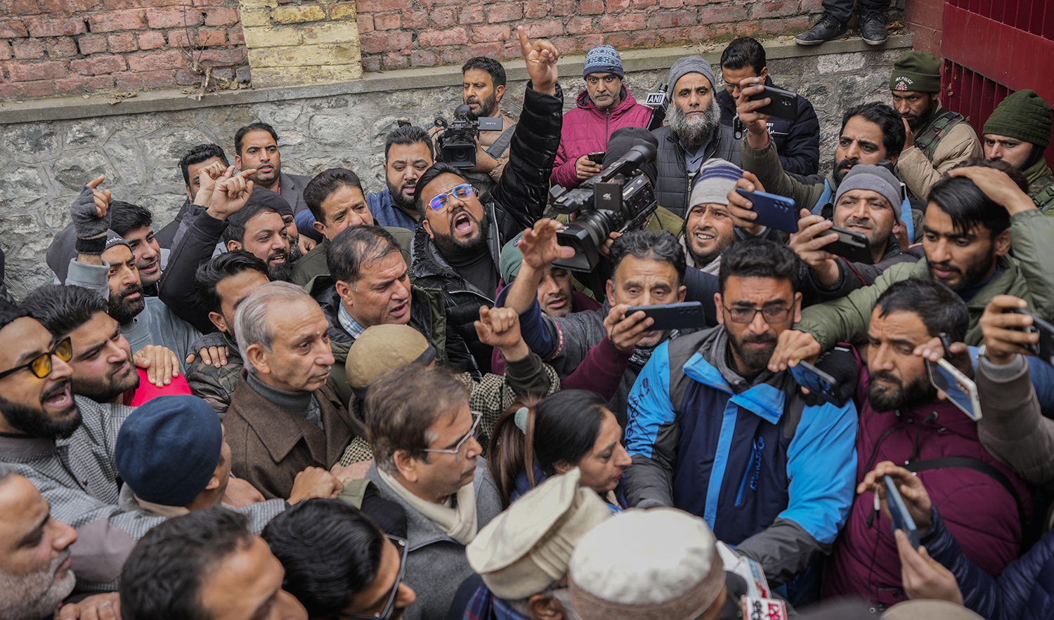 Supporters of Jammu Kashmir National Conference shout slogans during a protest in Srinagar, Indian-controlled Kashmir, on December 23, 2023. (AP)