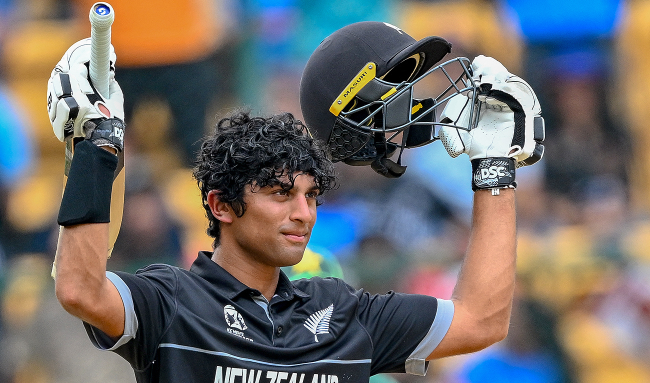 New Zealand's Rachin Ravindra celebrates after scoring a century (100 runs) during the 2023 ICC Men's Cricket World Cup one-day international (ODI) match between New Zealand and Pakistan at the M. Chinnaswamy Stadium in Bengaluru on November 4, 2023. (AFP)