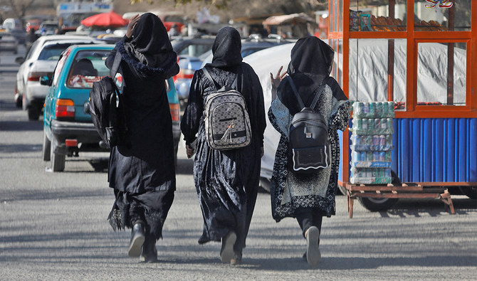 Afghan female students walk near Kabul University in Kabul, Afghanistan, on December 21, 2022. (REUTERS)