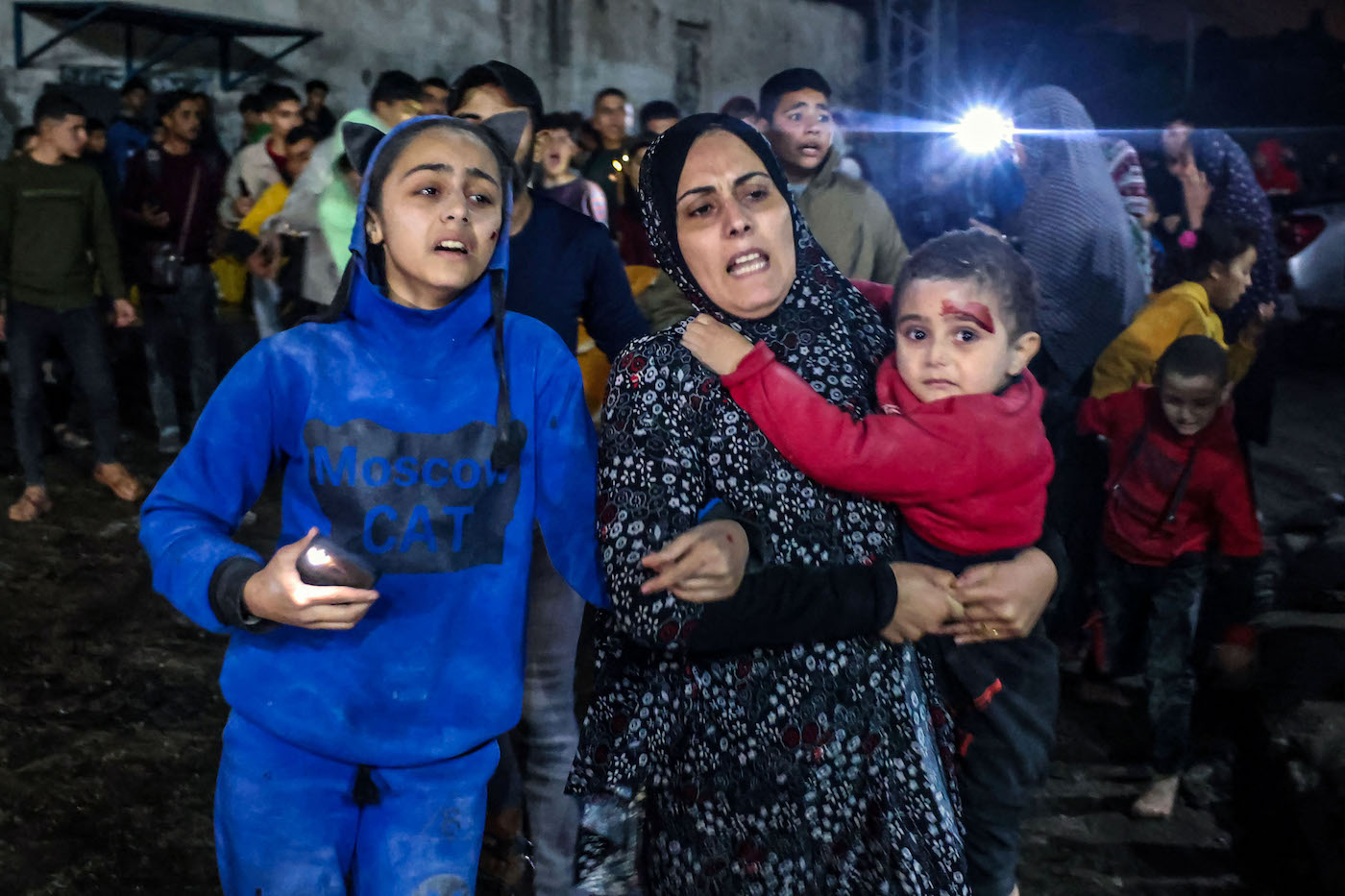 Victims of an Israeli army strike arrive at Kuwait hospital in Rafah in the southern Gaza Strip on Dec. 28, 2023. (AFP)