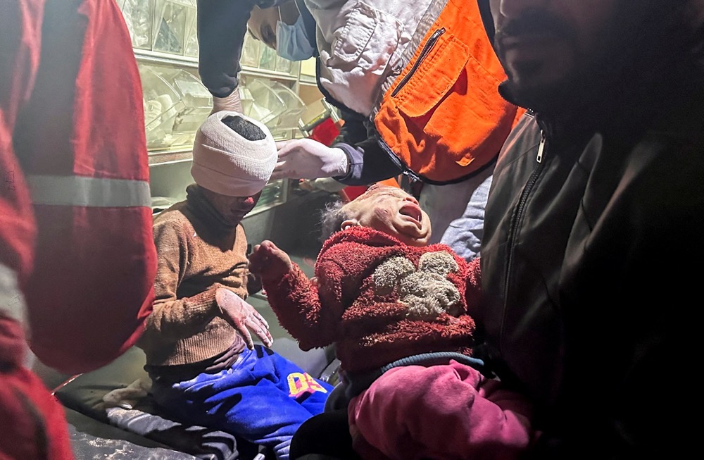 Palestinian girl Mariam Abu Akel and her brother Hamed were rescued from under the rubble of a house hit by an Israeli strike. (Reuters)