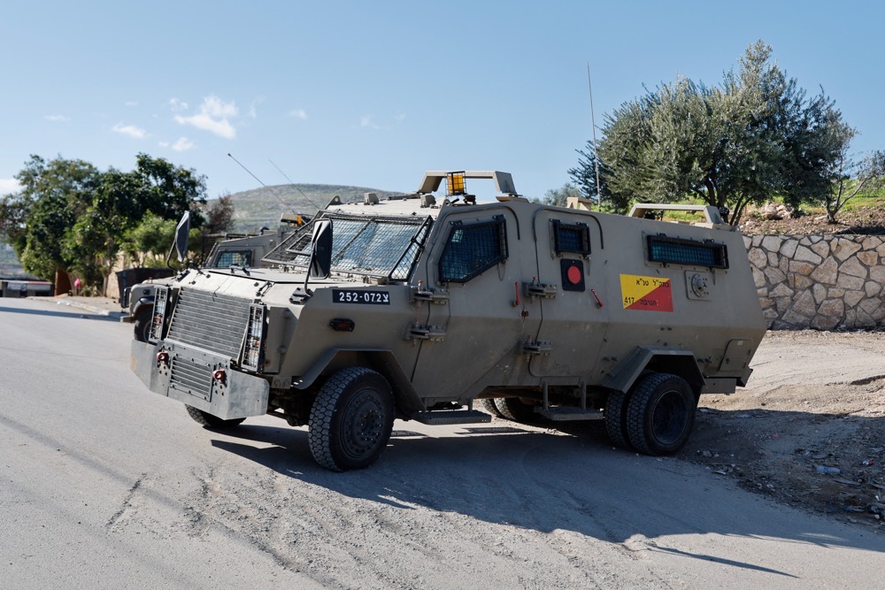 An Israeli military vehicle blocks a road during an Israeli raid, in Far'a refugee camp near Tubas, in the Israeli-occupied West Bank. (Reuters)