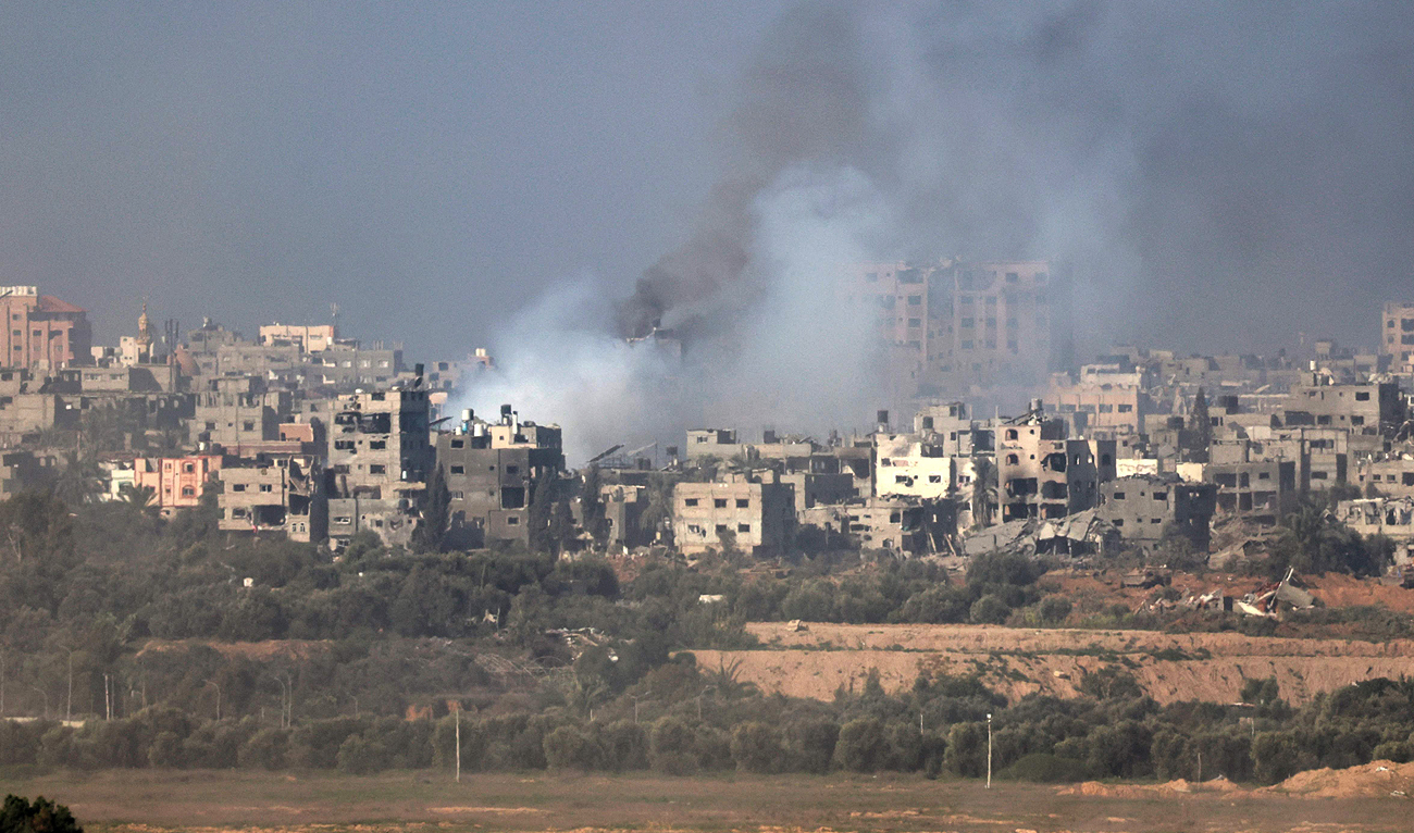 This picture taken from the Israeli border with the Gaza Strip shows smoke billowing over central Gaza following Israeli strikes on December 31, 2023, as battles continue between Israel and the Hamas movement. (AFP)