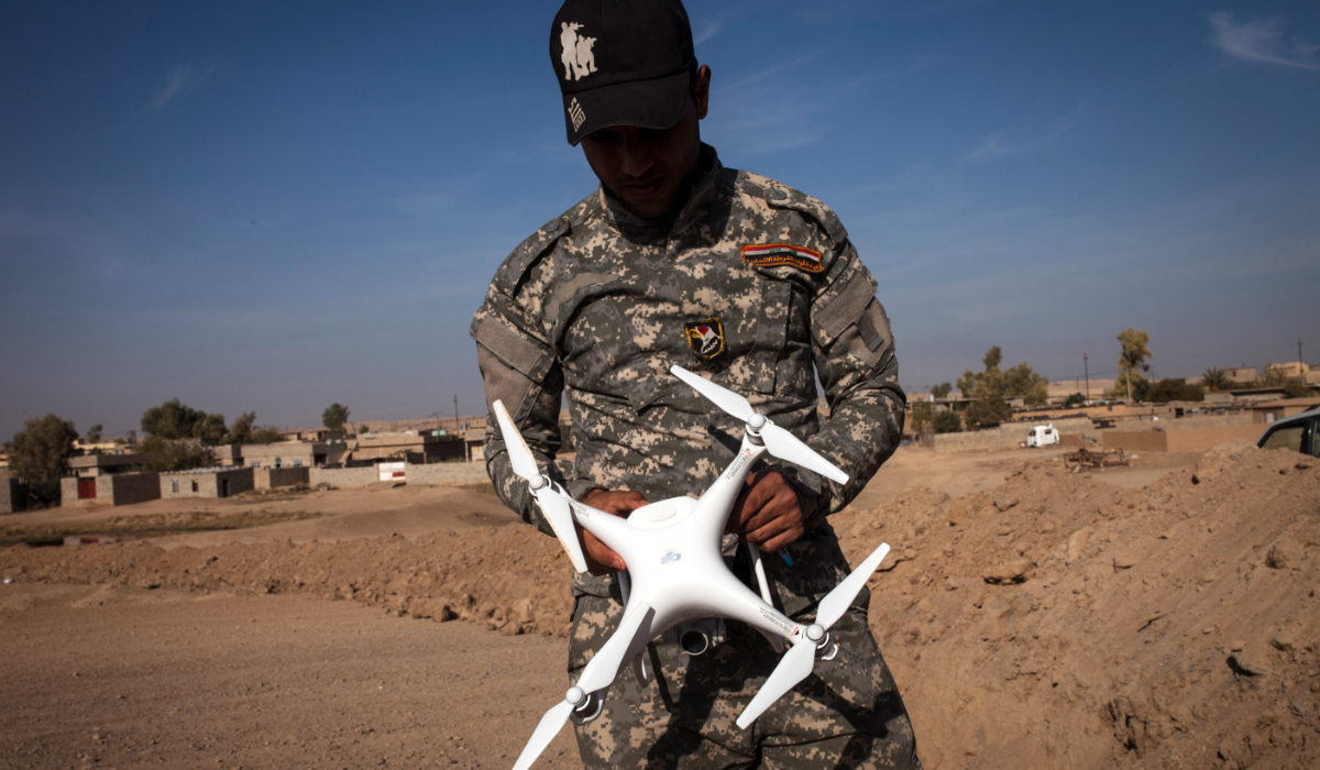 An Iraqi Policeman holds a drone near the village of Arbid, on the southern Mosul front, on November 12, 2016 during the ongoing military operation to retake Mosul from the Islamic State (IS) group. Iraqi forces launched a massive operation to retake the country's second city from the Islamic State group on October 17, and the Counter-Terrorism Service (CTS) special forces have pushed the jihadists back from some Mosul neighbourhoods. (AFP)