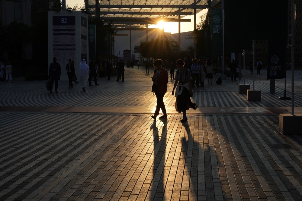 People walk through the COP28 U.N. Climate Summit, Tuesday, Dec. 5, 2023, in Dubai, United Arab Emirates. (AP)