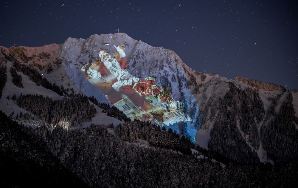The 2,042 meters high Rochers-de-Naye alpine mountain is illuminated with a giant Santa, Les Avants, Switzerland, Dec. 6, 2023. (AFP)