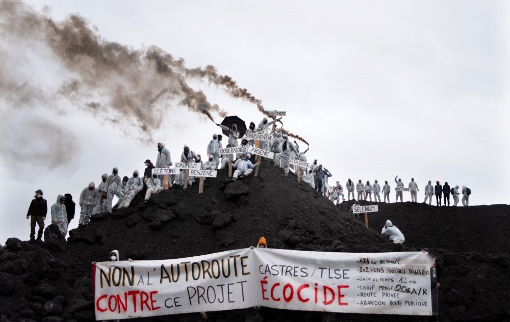 People take part in a demonstration against the planned construction of the A69 highway on the site of its future tar plant, near Puylaurens, southwestern France, Dec. 9, 2023. (AFP)