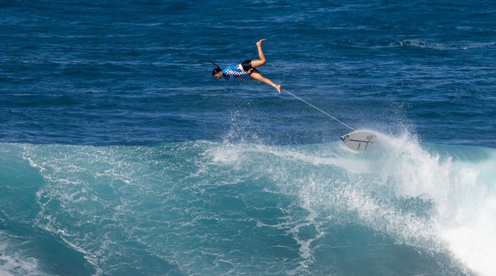 Hawaii's BettyLou Sakura Johnson wipes out on the first day of the women's event of the 2023 Vans Pipeline Masters at Backdoor Pipeline on Oahu’s North Shore, Dec. 9, 2023. (AFP)
