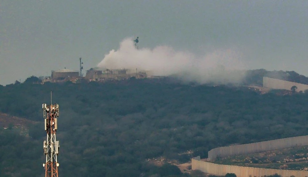 Smoke billows from a Israeli army post after it was hit by a rocket fired from Lebanon, Dec. 12, 2023. (AFP)
