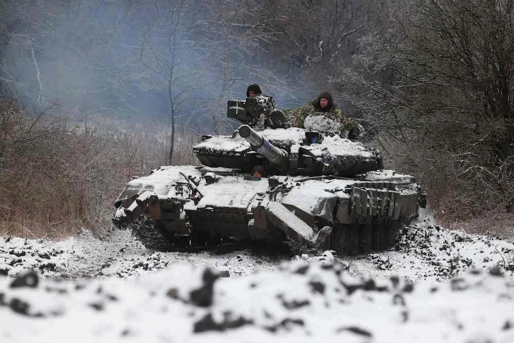 Above, Ukrainian soldiers drive a tank in a position near to the town of Bakhmut, Donetsk region on Dec. 13, 2023. (AFP)