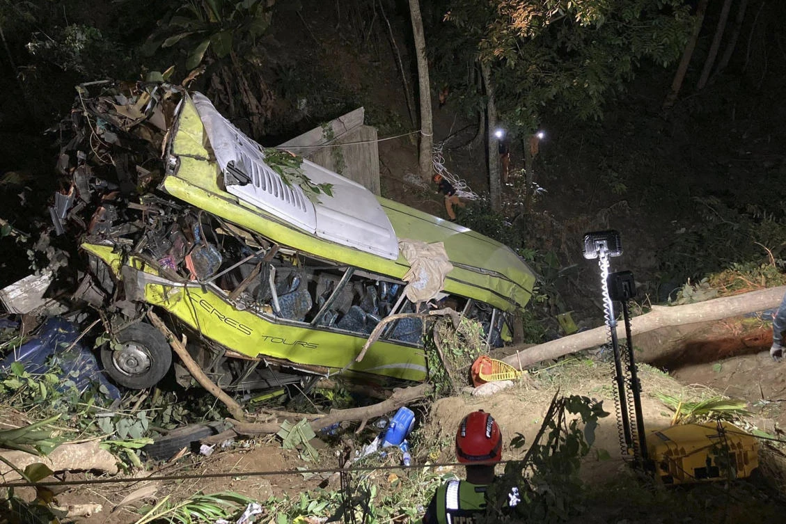 The bus was traveling to Culasi in Antique from the neighboring province of Iloilo when its brakes malfunctioned on a winding road and it plunged 30 meters into the ravine. (Iloilo City Disaster Risk Reduction and Management Office – Urban Search and Rescue Unit via AP)