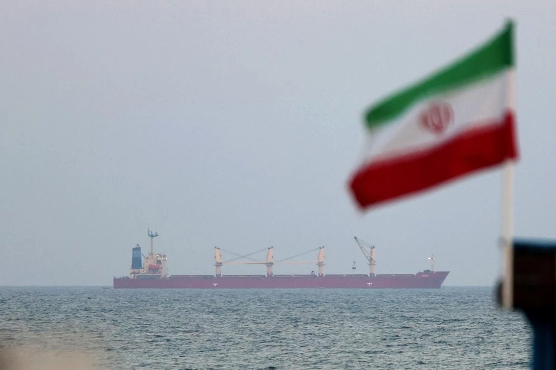 A picture taken on April 29, 2023, shows a shipping vessel sailing past Iran's Gulf island of Qeshm. (AFP)