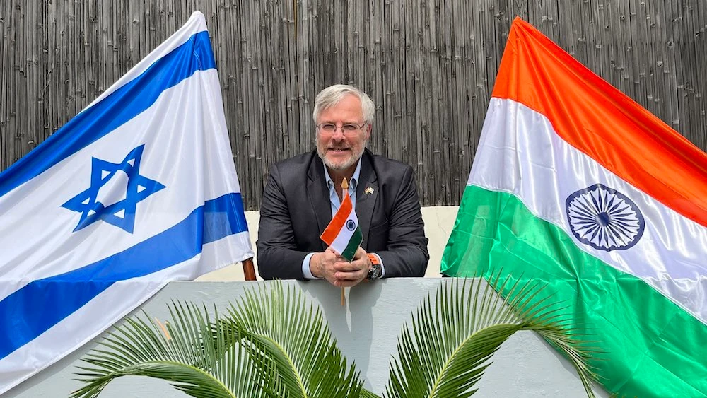 Israel’s ambassador to New Delhi, Naor Gilon, poses with India’s flag in a photo he shared on social media on Aug. 15, 2023. (Naor Gilon)