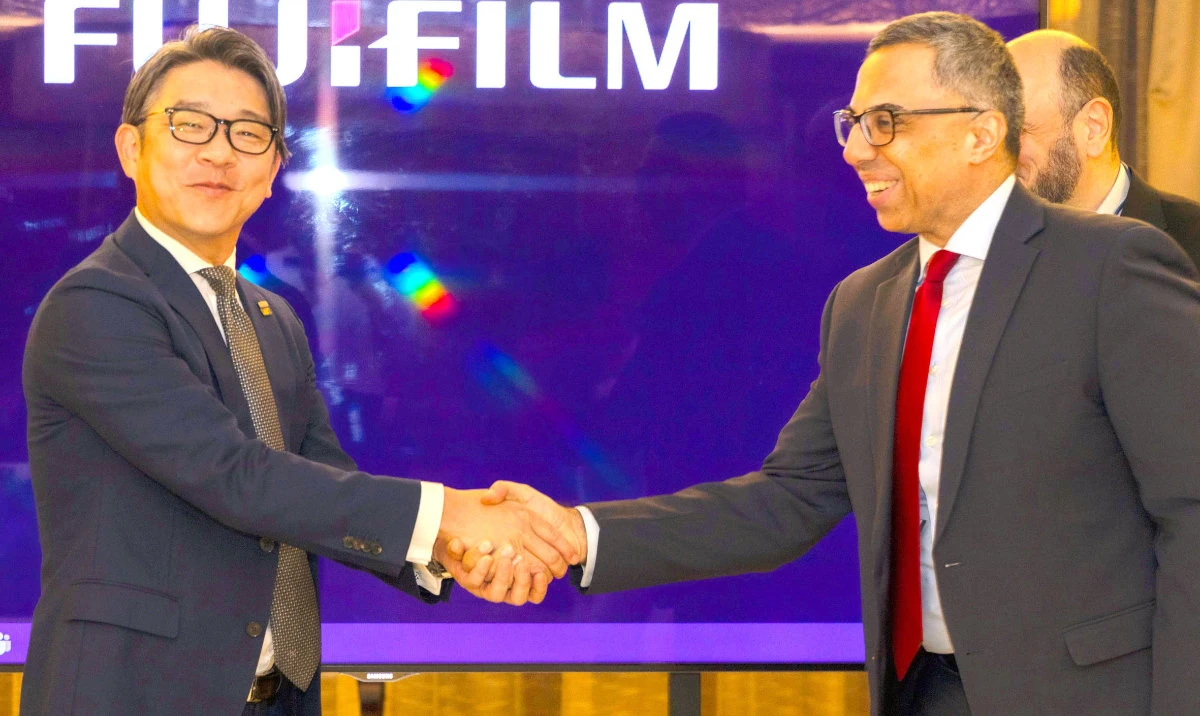 From left, Iwai Kentaro, division manager, Fujifilm, and Hasan Metla, representing GBS, shake hands after signing the strategic agreement.