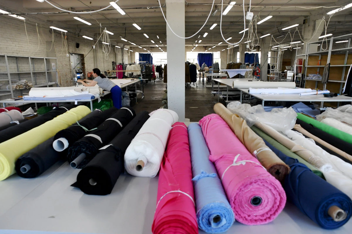 An employee works at the garment factory of the YOU clothing brand in Saint Petersburg on August 10, 2023. Russia's emerging fashion industry is rushing to fill the gap left by the departure of major Western labels such as Adidas, H&M and Zara. (AFP/File)