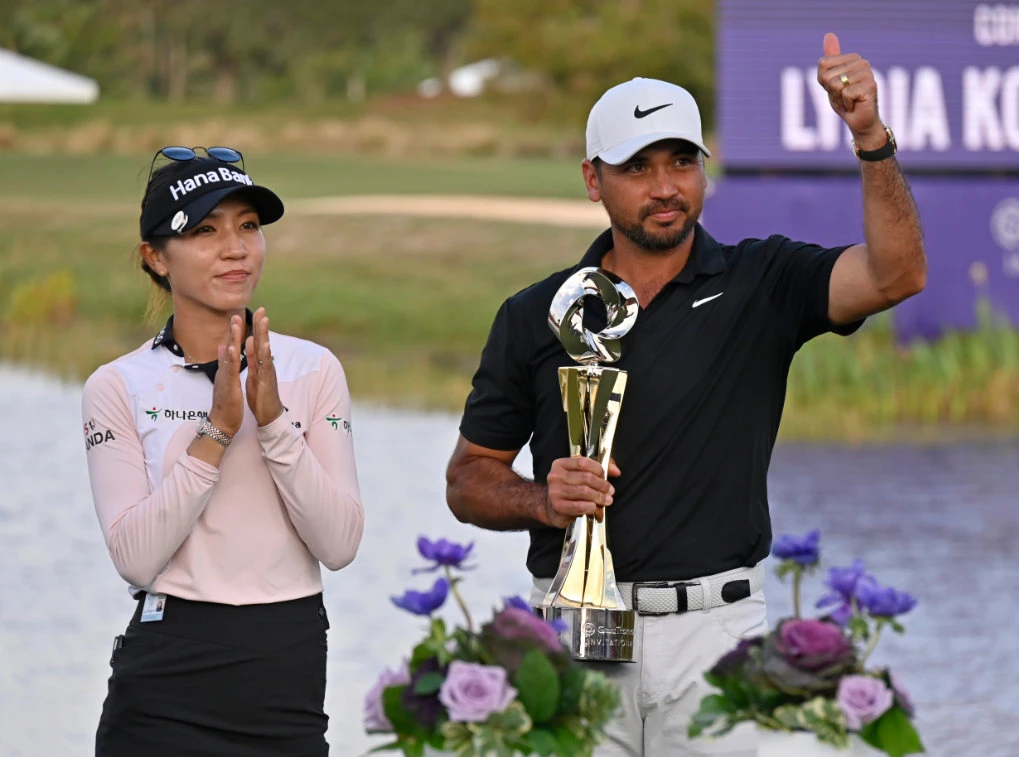 Lydia Ko, left, and Jason Day celebrate with the championship trophy after winning the Grant Thornton Invitational, the first mixed-team golf tournament since 1999, Sunday in Naples, Fla. (AP)
