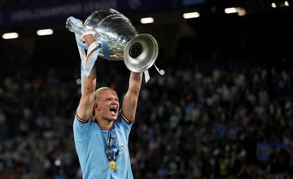 Manchester City’s Erling Haaland celebrates with the trophy after winning the Champions League, Ataturk Olympic Stadium, Istanbul, Turkiye, June 11, 2023. (Reuters)