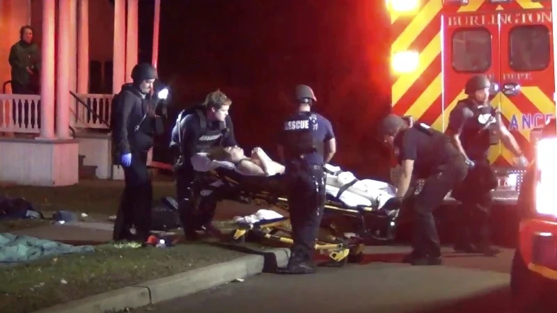 In a still frame from video first responders use a gurney to place an injured man into an ambulance while transporting him from the scene of a shooting, Saturday, Nov. 25, 2023, in Burlington, Vt.(AP)