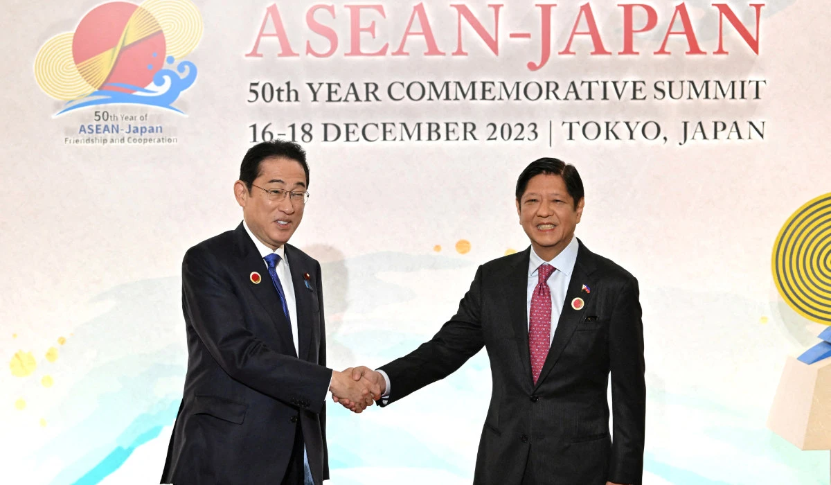 Japan’s Prime Minister Fumio Kishida greets Philippine President Ferdinand Marcos Jr. at the ASEAN-Japan Commemorative Summit Meeting in Tokyo on Sunday. (Reuters)