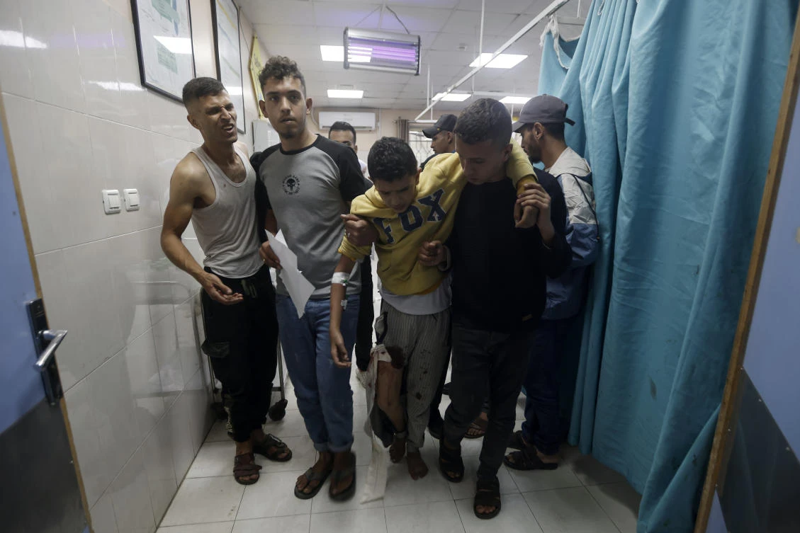 Palestinians wounded in Israeli airstrikes on a UN-run school arrive at the Nasser hospital in the town of Khan Younis, southern Gaza Strip on Sunday, Dec. 17, 2023. (AP)