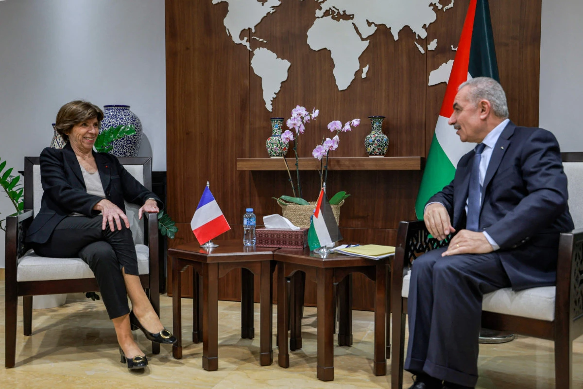 Palestinian Prime Minister Mohammad Shtayyeh (R) meets with the visiting French FM Catherine Colonna (L) at his headquarters in Ramallah in the occupied West Bank on December 17, 2023. (AFP)