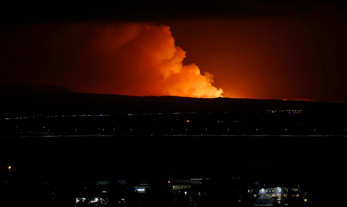 The night sky is illuminated caused by the eruption of a volcano on the Reykjanes peninsula of south-west Iceland seen from the capital city of Reykjavik, Monday Dec. 18, 2023. (AP)