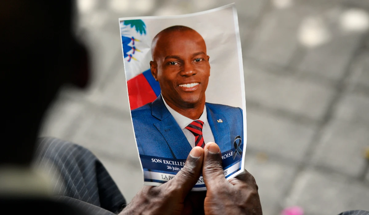 A person holds a photo of late Haitian President Jovenel Moise during his memorial ceremony at the National Pantheon Museum in Port-au-Prince, Haiti, July 20, 2021. (AP)