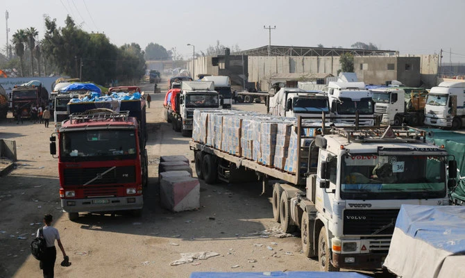 Humanitarian aid trucks enter through the Kerem Shalom crossing from Israel into the Gaza Strip on Monday, Dec. 18, 2023. (AP)