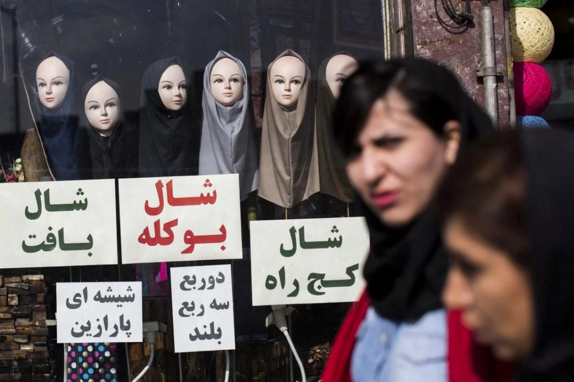 As part of efforts to enforce the ban over the past year, authorities have closed several businesses for not respecting the dress code. (AFP/File)