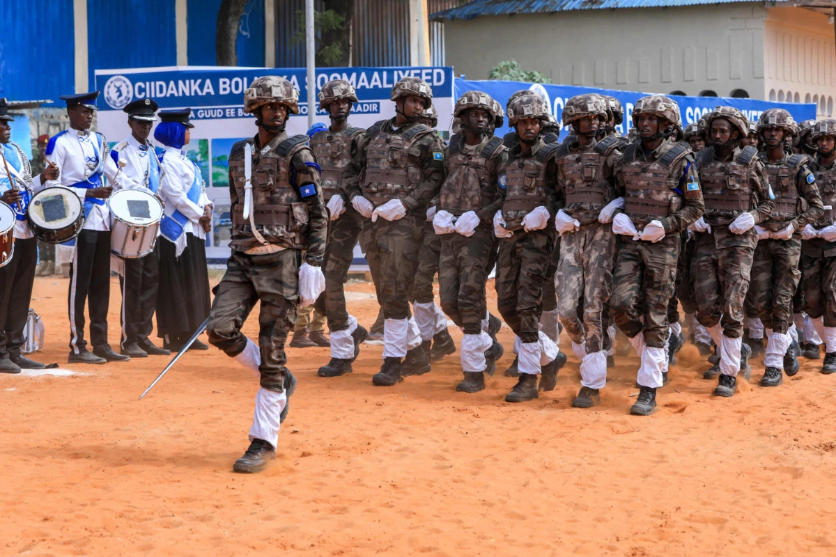 Somalia Police Force tactical units march during a ceremony at the Scoula Policia in Mogadishu on December 20, 2023. (Hassan Ali Elmi / AFP)