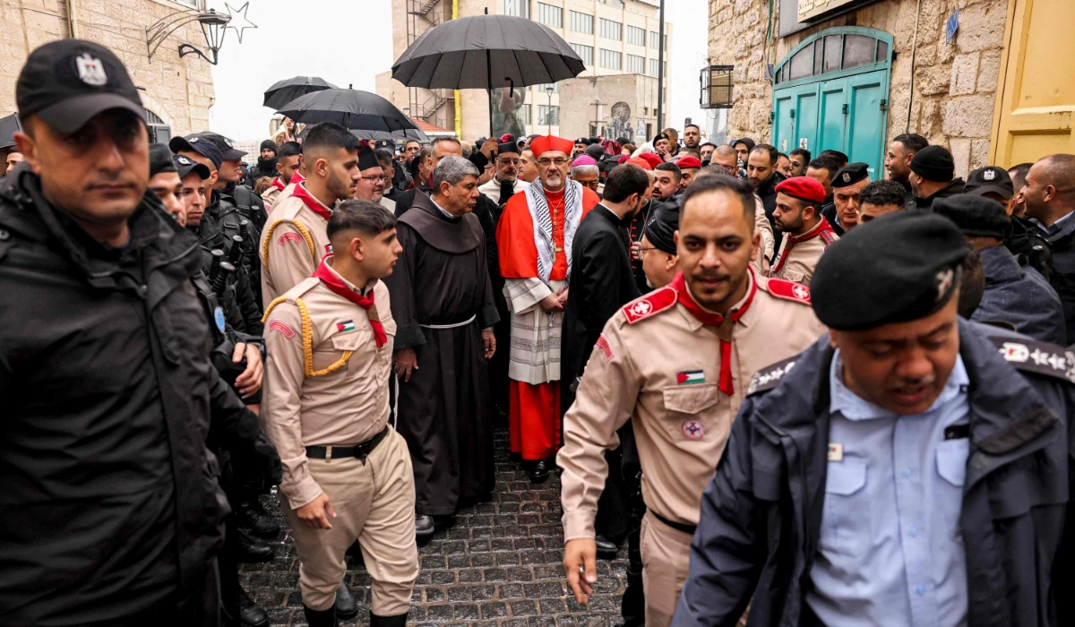 Latin Patriarch of Jerusalem Pierbattista Pizzaballa (C) arrives in the biblical city of Bethlehem in the occupied West Bank ahead of Christmas Eve celebrations (according to Western tradition) on December 24, 2023. (AFP)
