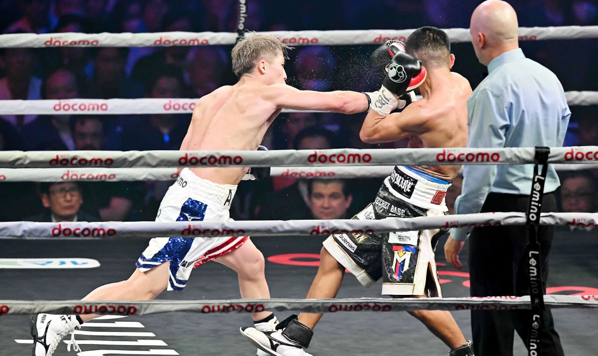 Japan’s WBC and WBO super bantamweight champion Naoya Inoue, left, fights against Philippines’ WBA and IBF champion Marlon Tapales. (AFP)