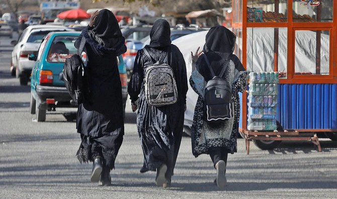 Afghan female students walk near Kabul University in Kabul, Afghanistan, on December 21, 2022. (REUTERS)