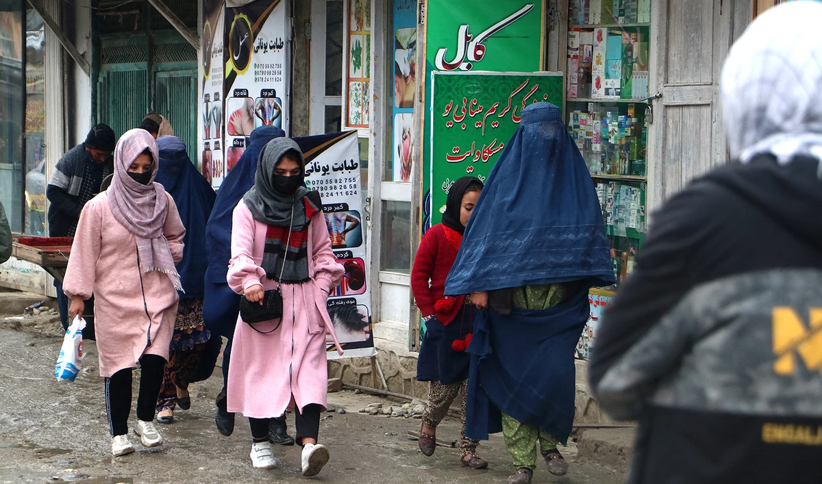 Afghan women walk along a street at a market in the Fayzabad district of Badakhshan province on December 12, 2023. (AFP)